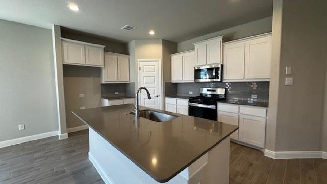 Kitchen - All Home and community information, including pricing, included features, terms, availability and amenities, are subject to change at any time without notice or obligation. All Drawings, pictures, photographs, video, square footages, floor plans, elevations, features, colors and sizes are approximate for illustration purposes only and will vary from the homes as built.