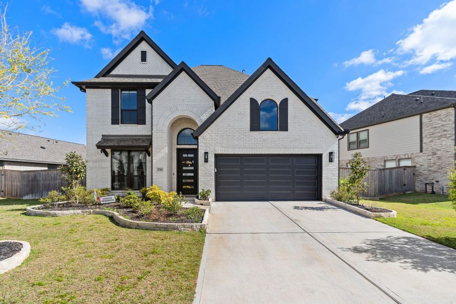 Front exterior of a new home in , Richmond, TX, highlighting curb appeal (Image 2). Front exterior of a new home in , Richmond, TX, highlighting curb appeal (Image 2).