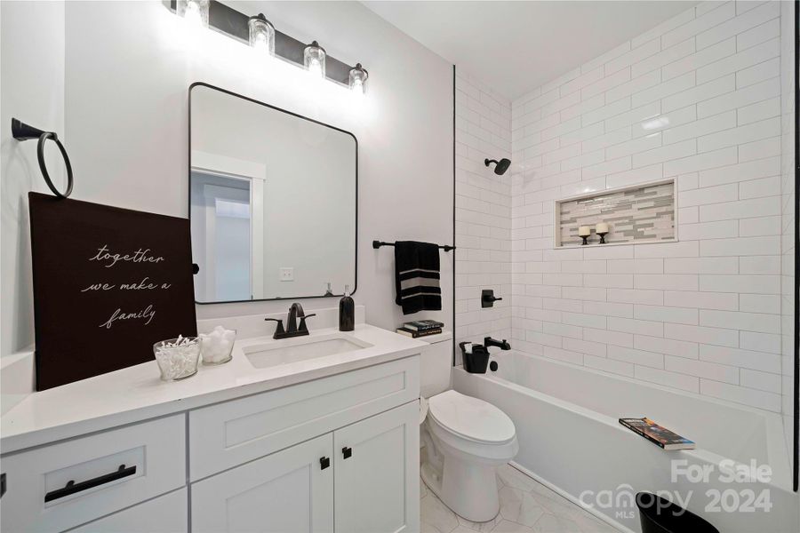 Bath 3 with tiled Shower & quartz counters.