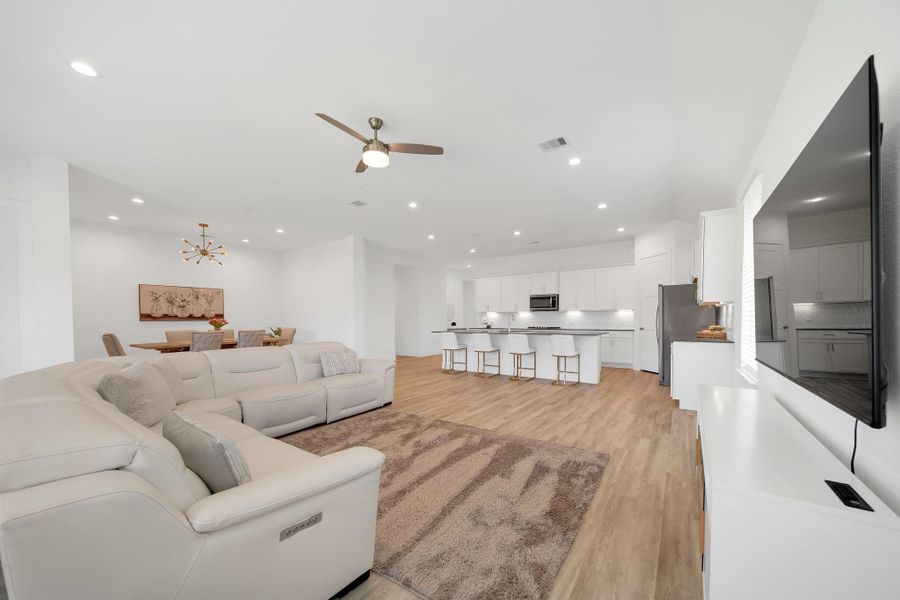 The open-concept layout connects the kitchen, living and dining area.