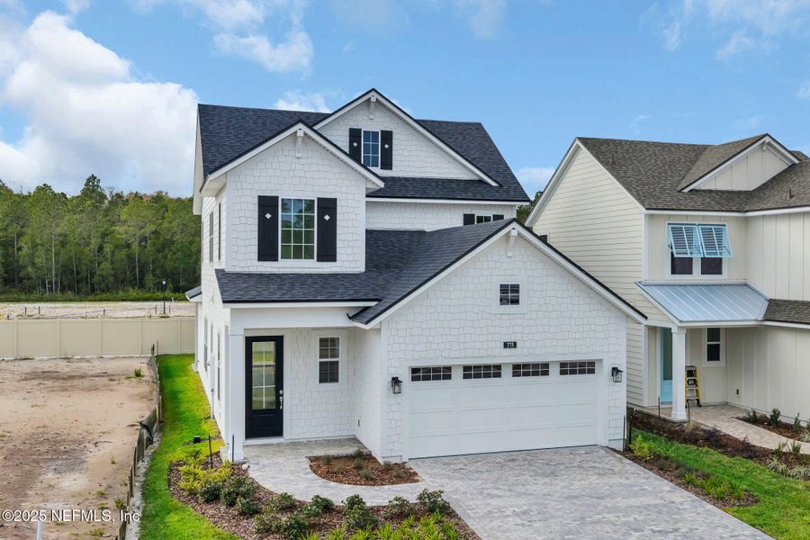 Front exterior of a new home in Seabrook Village at Seabrook, Ponte Vedra, FL, highlighting curb appeal (Image 24).