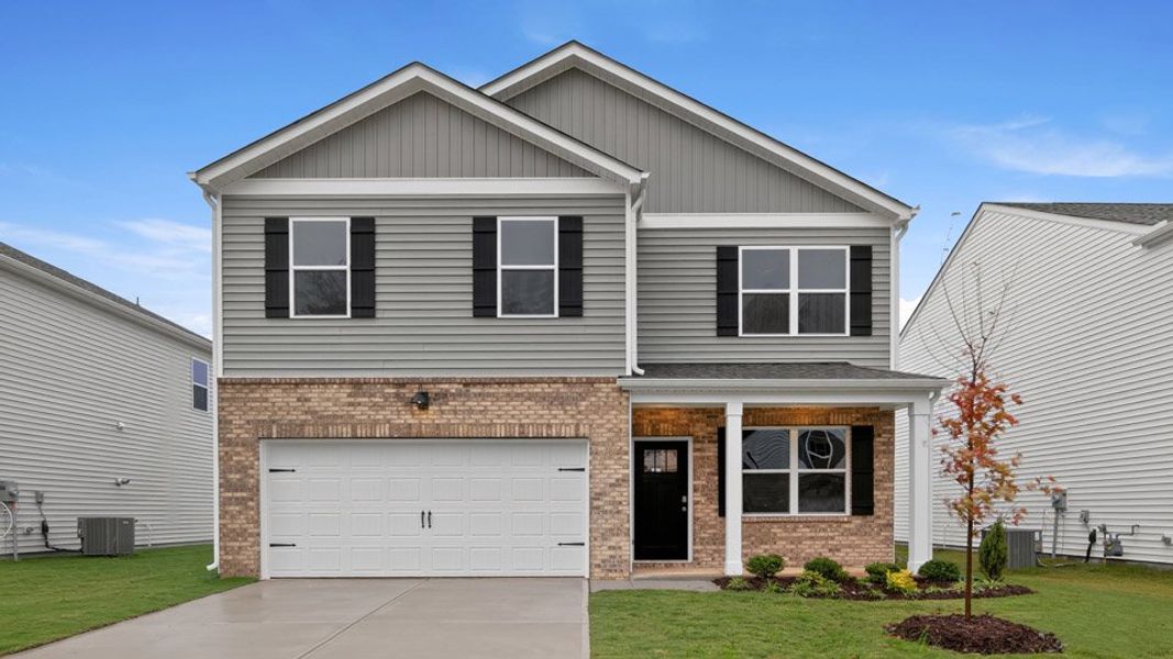 Representative exterior photo of a completed home built from the BELHAVEN by D.R. Horton in Galvins Ridge, Sanford, NC (Image 17).