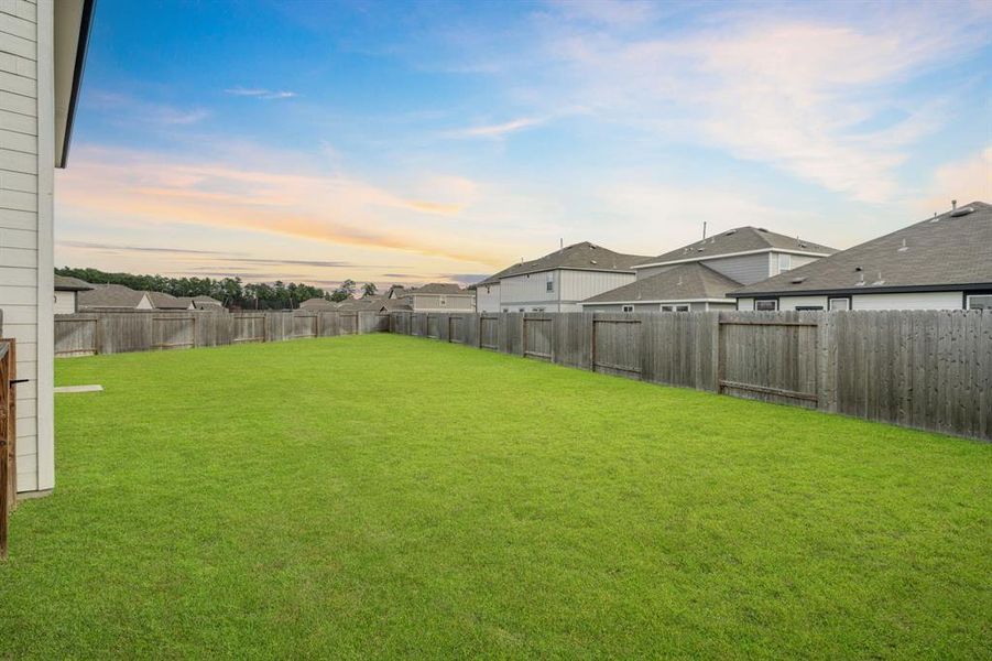 A stunning view of the Beautiful Backyard which offers an abundance of greenspace on an oversized cul-de-sac lot!