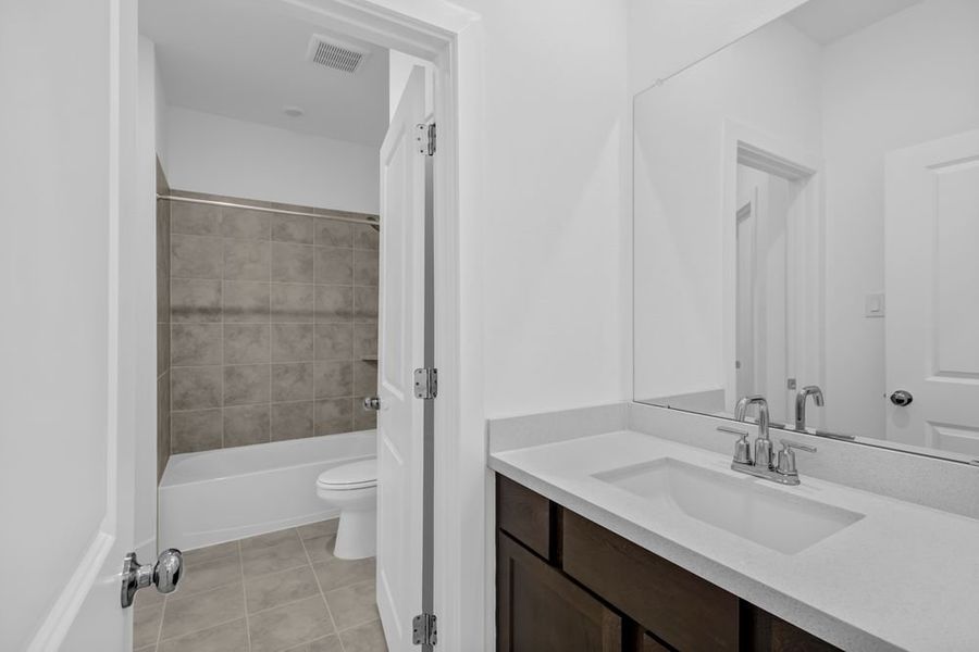Furnished interior view inside a new home in Avalon at Friendswood 70s, Friendswood (Image 18).