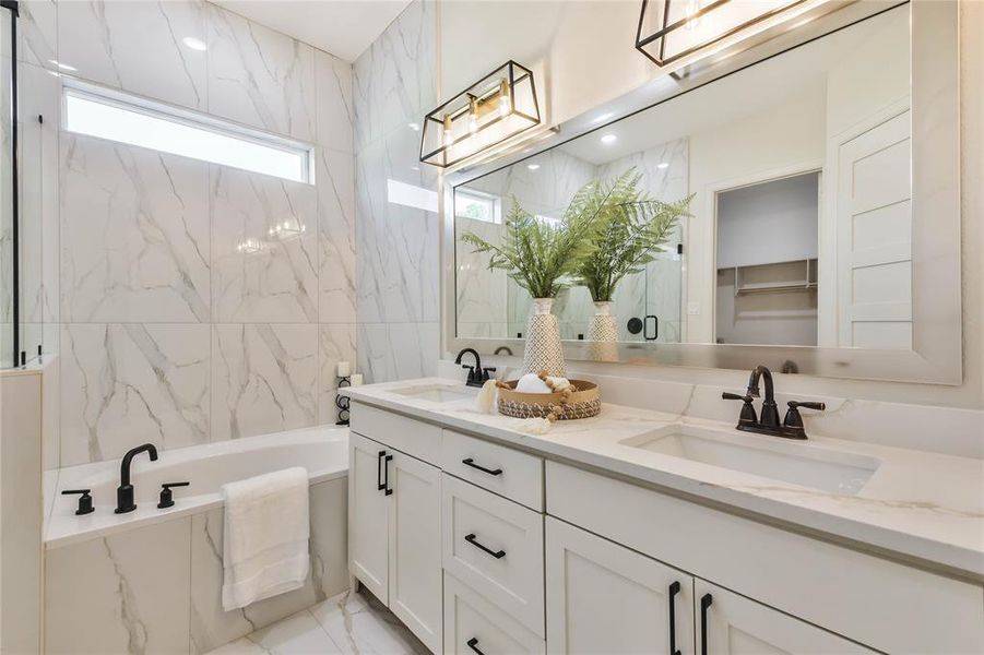 Beautiful upgraded light fixtures and matte black faucets and hardware.