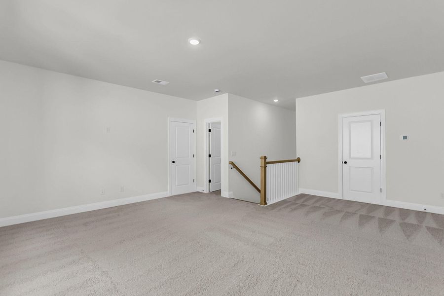 Spacious, unfurnished interior of a new home in Tidewater at Lakes of Cane Bay, Summerville (Image 15). Spacious, unfurnished interior of a new home in Tidewater at Lakes of Cane Bay, Summerville (Image 15).