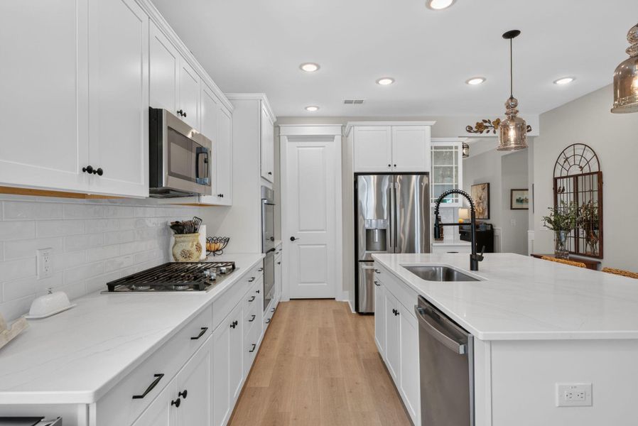 Furnished interior view inside a new home in K. Hovnanian's® Four Seasons at Lakes of Cane Bay, Summerville (Image 37).