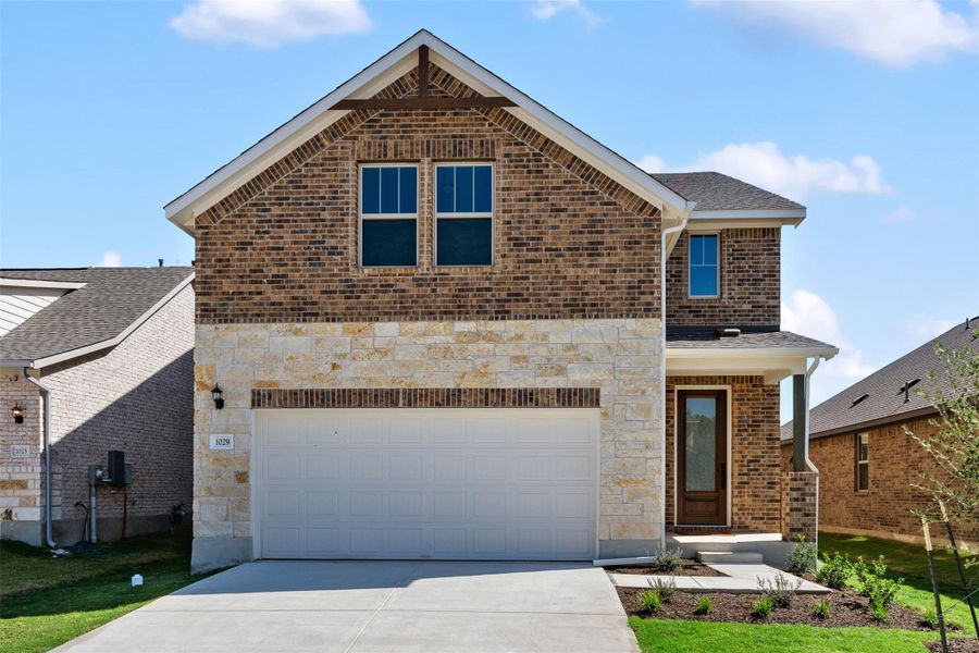 Front exterior of a new home in Berry Creek Highlands, Georgetown, TX, highlighting curb appeal (Image 14).