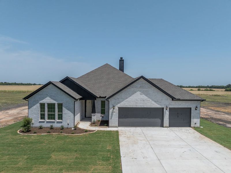 Representative exterior photo of a completed home built from the Keystone by Stonehollow Homes in Heritage Grove, Blue Ridge, TX (Image 28).