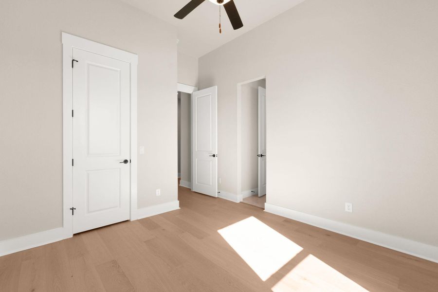 Unfurnished bedroom with light wood-type flooring and a ceiling fan