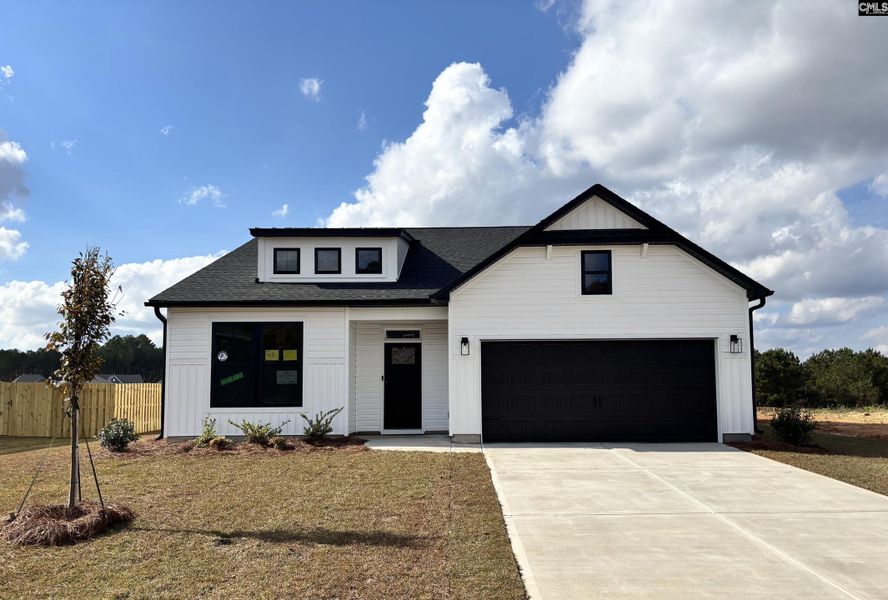 Front exterior of a new home in Rolling Hills, Prosperity, SC, highlighting curb appeal (Image 1).