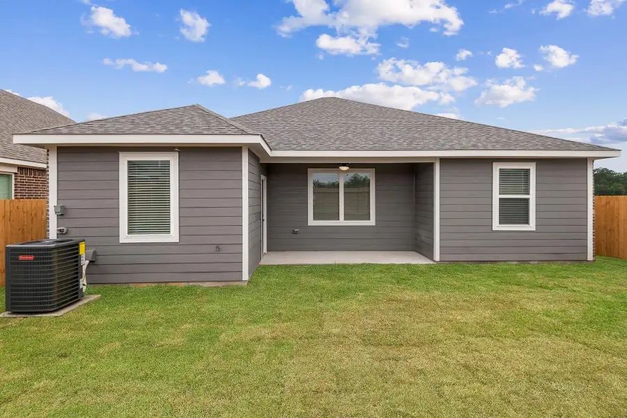 Front exterior of a new home in Magnolia Woods, Magnolia, TX, highlighting curb appeal (Image 1). Front exterior of a new home in Magnolia Woods, Magnolia, TX, highlighting curb appeal (Image 1).