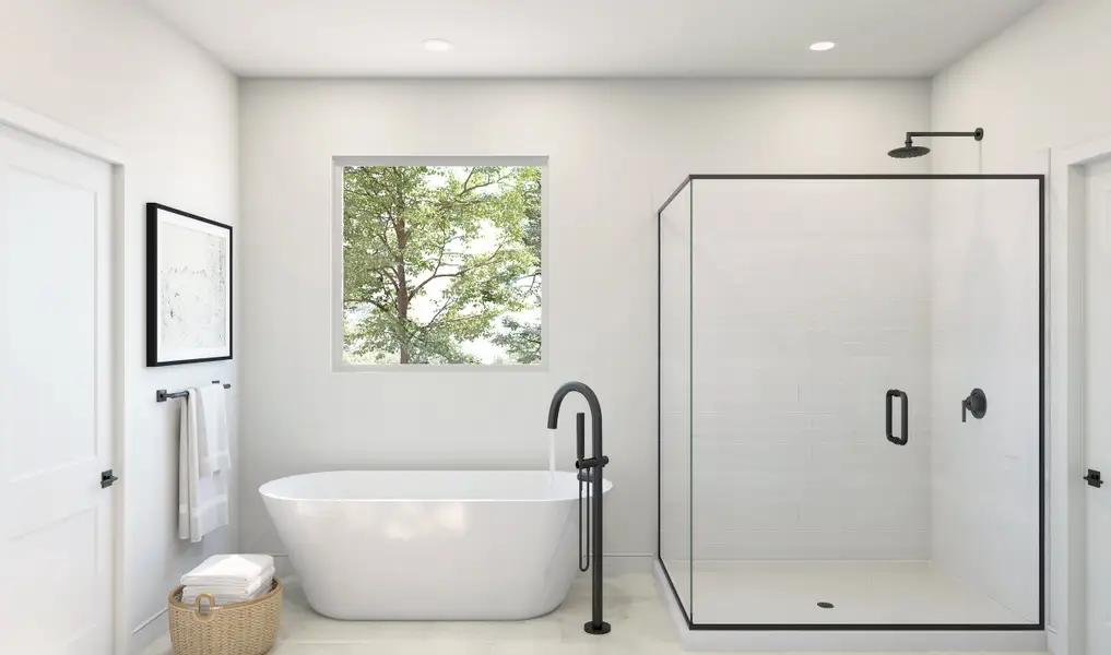 Primary bath with freestanding vanity and glass shower enclosure Primary bath with freestanding vanity and glass shower enclosure