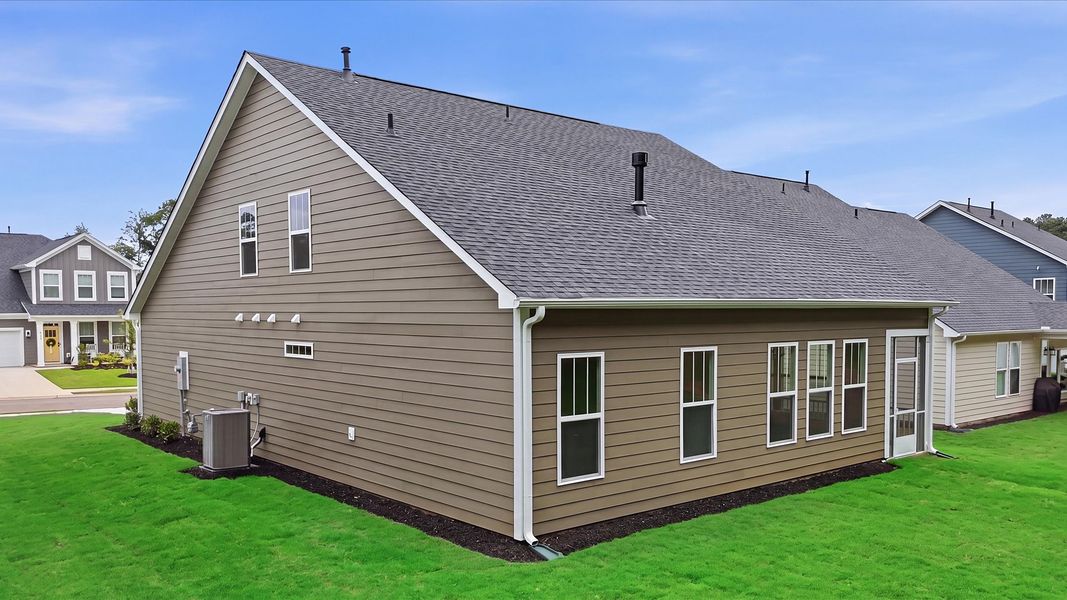 Eye-catching rear exterior with timeless color palette and superior architectural detail at Creeks at Midway
