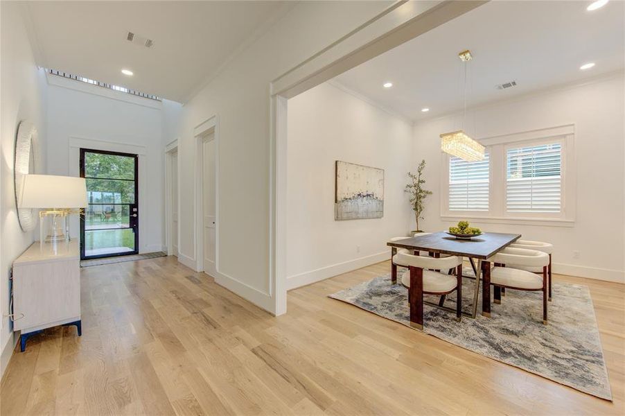 Formal Dining with beautiful chandelier. Plantation Window Shutter in every room.