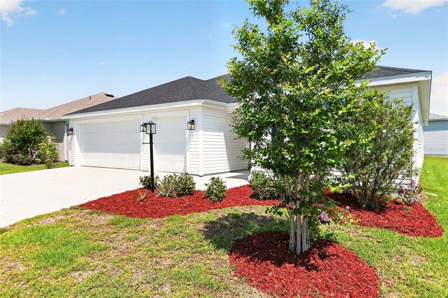 Front exterior of a new home in , The Villages, FL, highlighting curb appeal (Image 31).