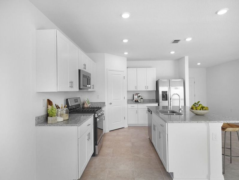 Representative furnished interior of a home built from the Azalea by Taylor Morrison in Waterstone, Groveland (Image 10).