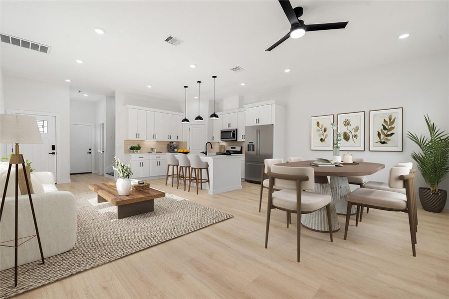 Spacious open-concept layout featuring seamless flow between the living, dining, and kitchen areas. Highlights include wood-look flooring, recessed lighting, high ceilings, and modern finishes throughout. *Virtually Staged Spacious open-concept layout featuring seamless flow between the living, dining, and kitchen areas. Highlights include wood-look flooring, recessed lighting, high ceilings, and modern finishes throughout. *Virtually Staged