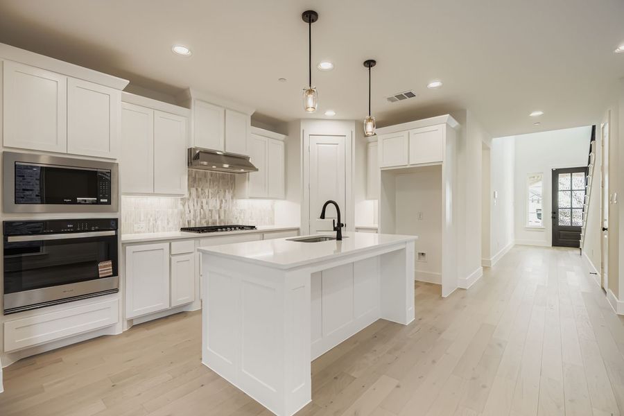 Furnished interior view inside a new home in Castle Hills Northpointe - Townhomes, Carrollton (Image 6). Furnished interior view inside a new home in Castle Hills Northpointe - Townhomes, Carrollton (Image 6).