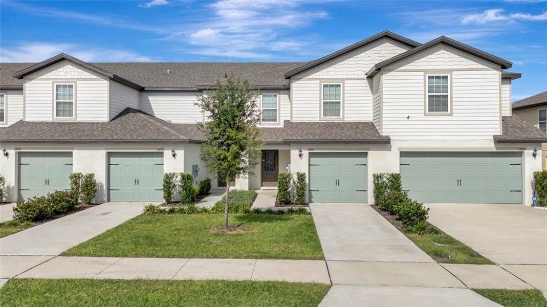 Front exterior of a new home in Hamlets of Tavares, Tavares, FL, highlighting curb appeal (Image 2). Front exterior of a new home in Hamlets of Tavares, Tavares, FL, highlighting curb appeal (Image 2).