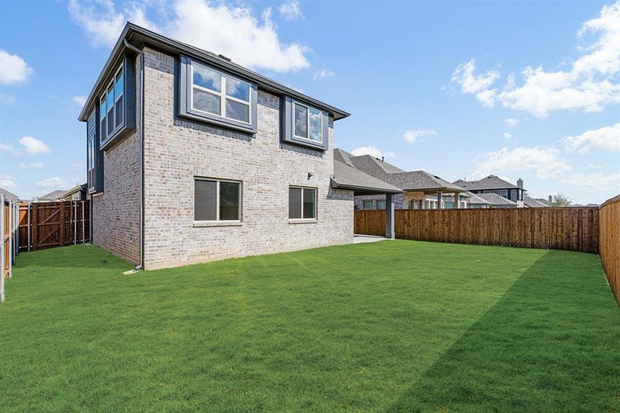 Exterior details and patio area of a home in Woodstone, Providence Village (Image 16). Exterior details and patio area of a home in Woodstone, Providence Village (Image 16).