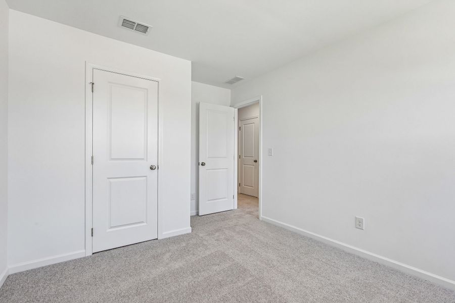 Spacious, unfurnished interior of a new home in Weatherfield, Buford (Image 19).