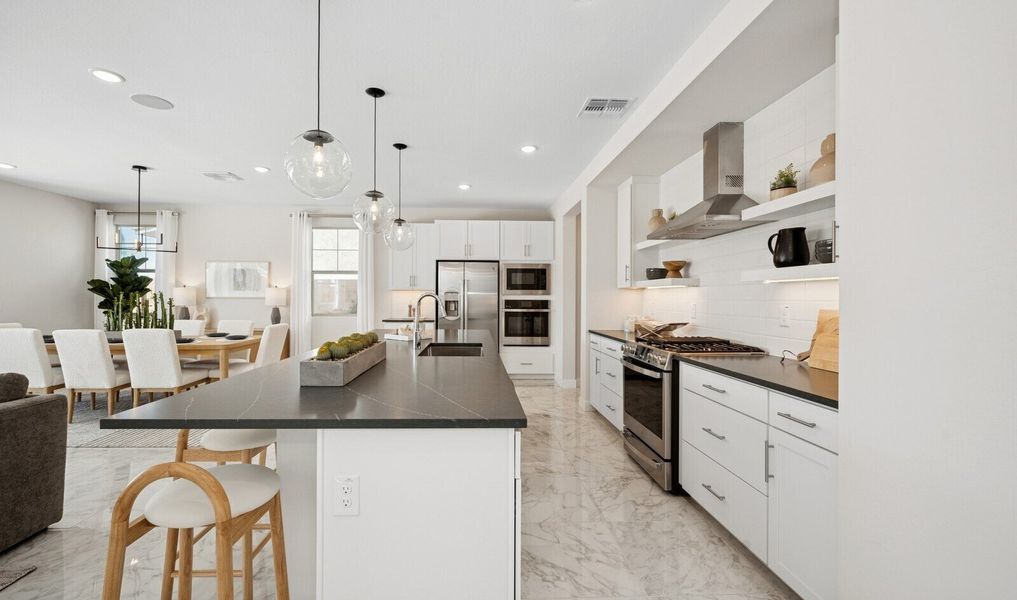 Kitchen with floating shelves and stainless steel hood vent
