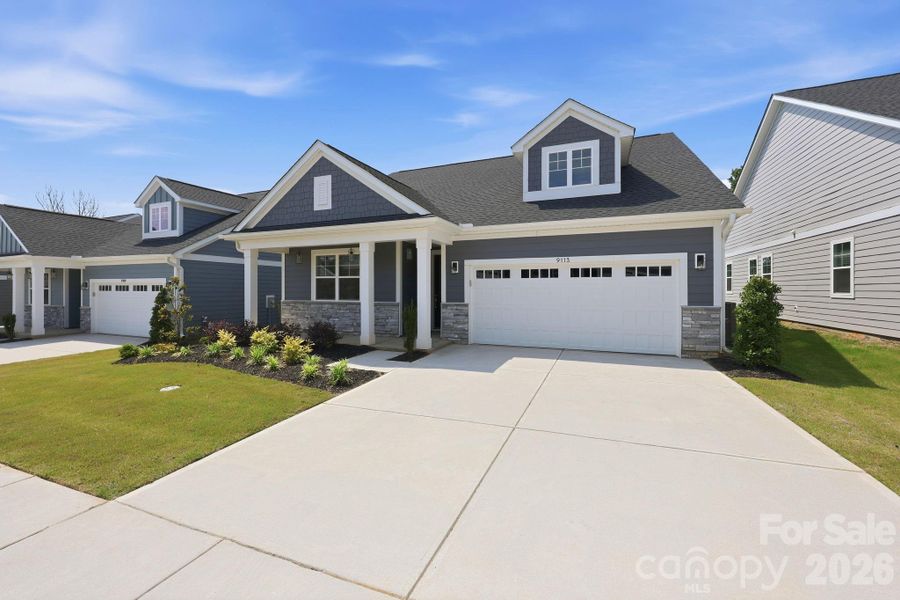 Front exterior of a new home in , Cornelius, NC, highlighting curb appeal (Image 1). Front exterior of a new home in , Cornelius, NC, highlighting curb appeal (Image 1).