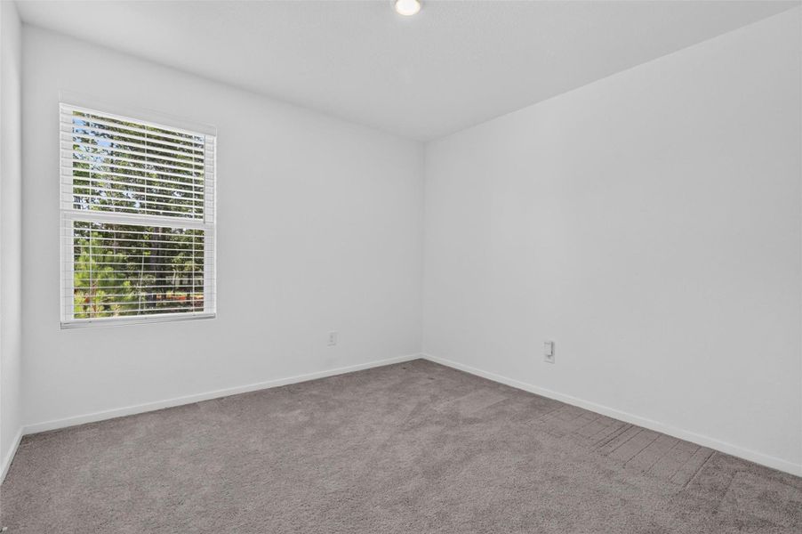 Third bedroom, in this 4/2.5 Home for sale in Magnolia ISD
