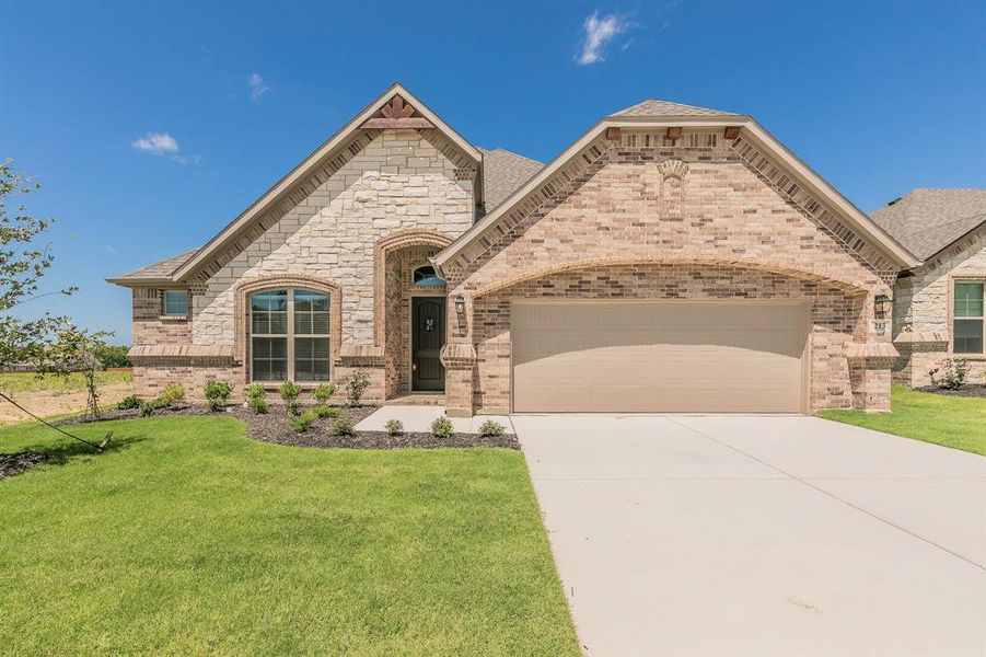 Front exterior of a new home in , Alvarado, TX, highlighting curb appeal (Image 21).