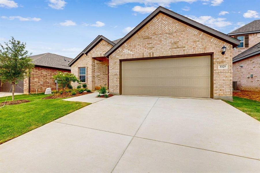 Front exterior of a new home in Kings Way, Denton, TX, highlighting curb appeal (Image 2).