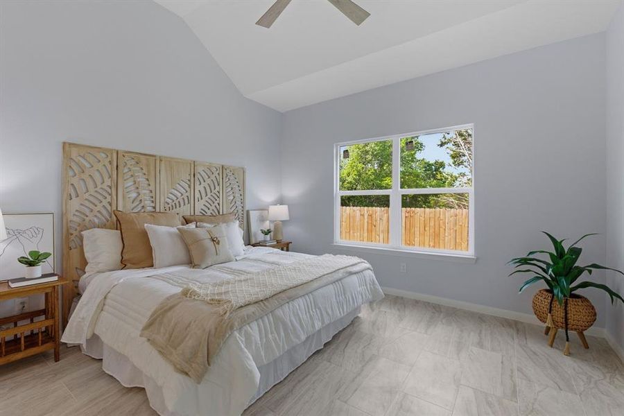 Bedroom with vaulted ceiling and ceiling fan Bedroom with vaulted ceiling and ceiling fan
