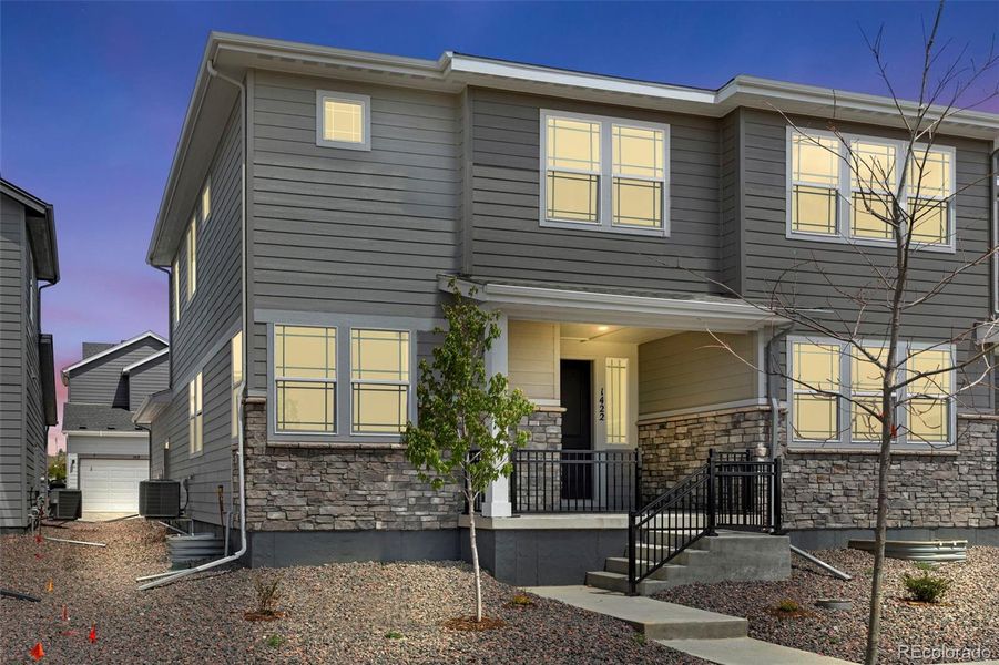 Front exterior of a new home in Sugar Mill Village, Longmont, CO, highlighting curb appeal (Image 19).