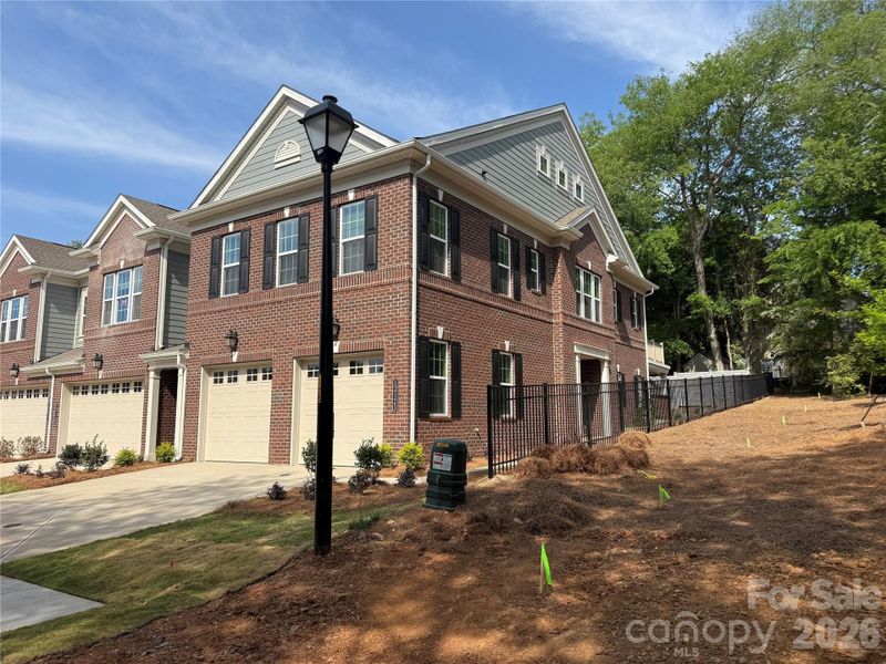 Front exterior of a new home in The Townes at Wade Ardrey, Charlotte, NC, highlighting curb appeal (Image 2).