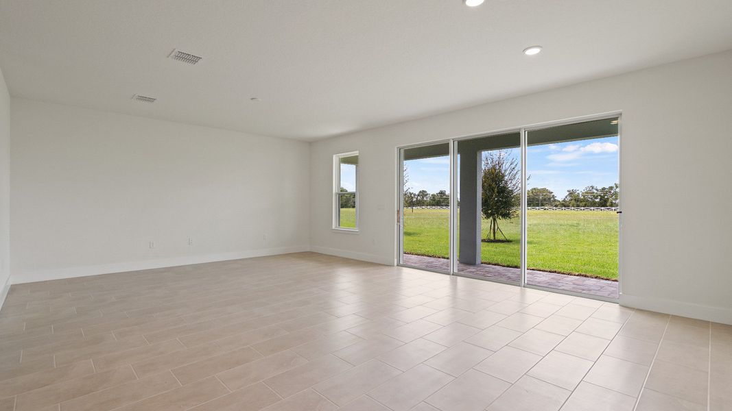 Living Area in the Buttonwood floorplan by DRB Homes at Lakeside at Satilla in Saint Cloud, FL