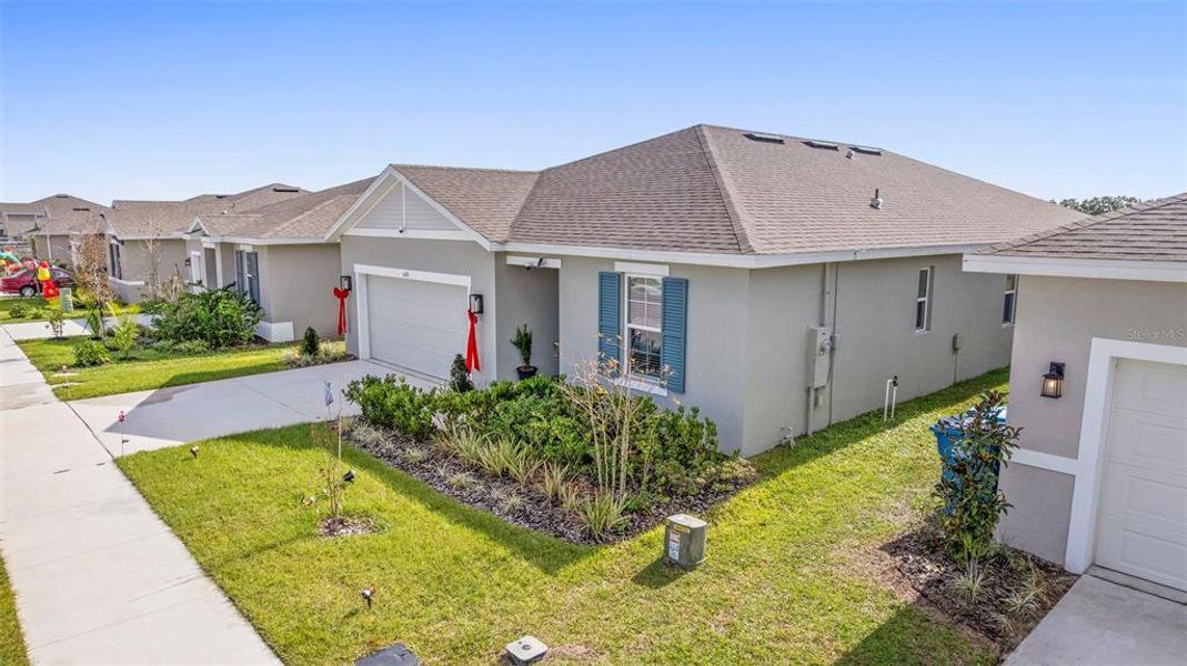 Front exterior of a new home in , Lake Wales, FL, highlighting curb appeal (Image 23). Front exterior of a new home in , Lake Wales, FL, highlighting curb appeal (Image 23).