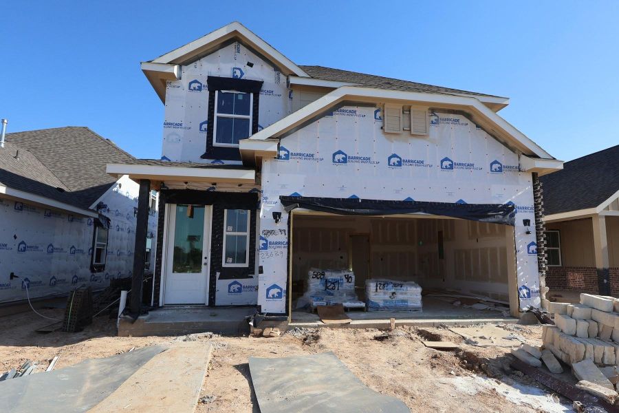 Two story home with 4 beds, 3.5 baths, and 2 car garage.