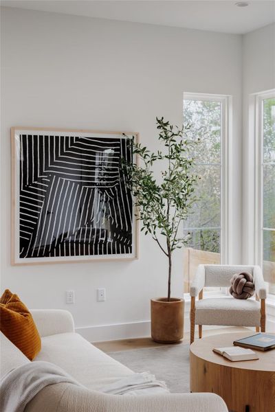 Living room with baseboards and wood finished floors