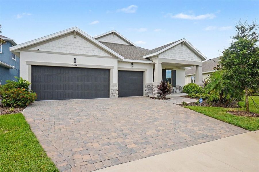 Front exterior of a new home in Seaire, Parrish, FL, highlighting curb appeal (Image 22).