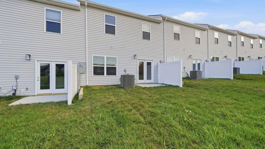 Exterior details and patio area of a home in The Arbor Townhomes, Kingsport (Image 3).