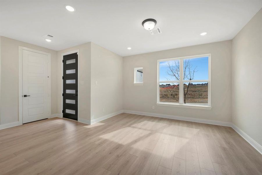 Unfurnished room featuring light wood-type flooring and recessed lighting