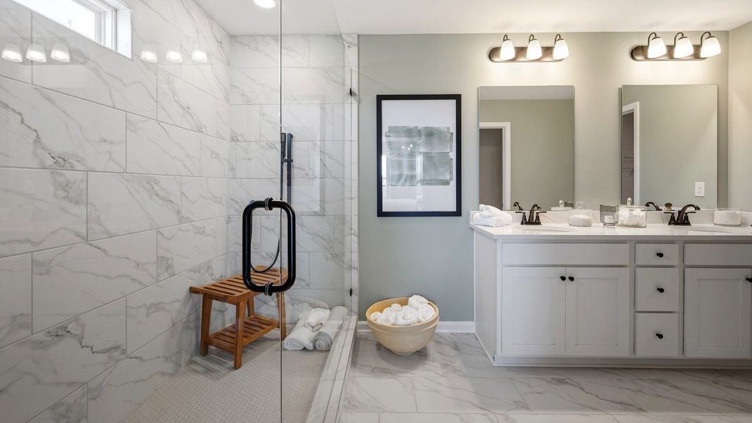Bathroom with spacious glass enclosed shower with a shower window Bathroom with spacious glass enclosed shower with a shower window