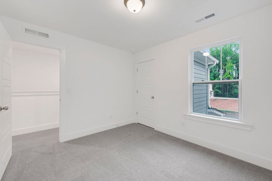 Spacious, unfurnished interior of a new home in Ashmore Townes, Garner (Image 15). Spacious, unfurnished interior of a new home in Ashmore Townes, Garner (Image 15).
