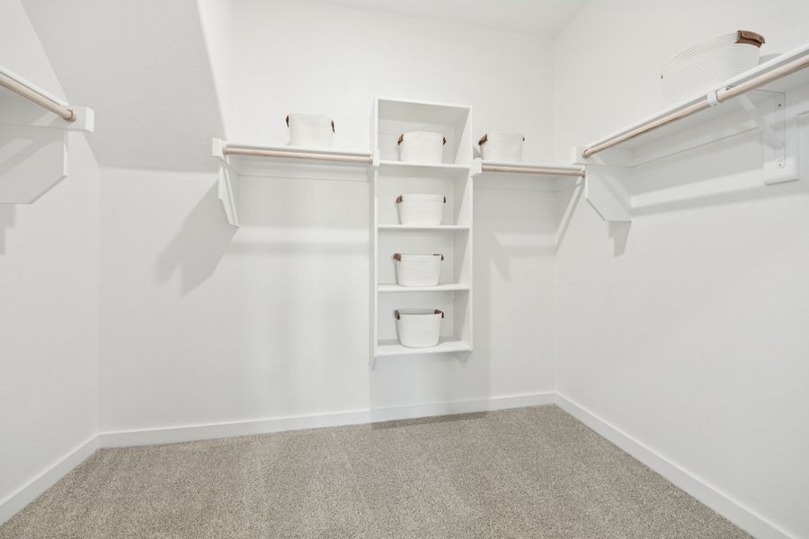 Primary Closet in a Belmont Magnolia Model Home in Aubrey TX by Trophy Signature Homes