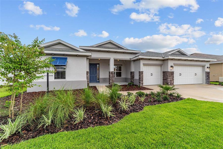 Front exterior of a new home in On Top of the World Communities, Ocala, FL, highlighting curb appeal (Image 1). Front exterior of a new home in On Top of the World Communities, Ocala, FL, highlighting curb appeal (Image 1).
