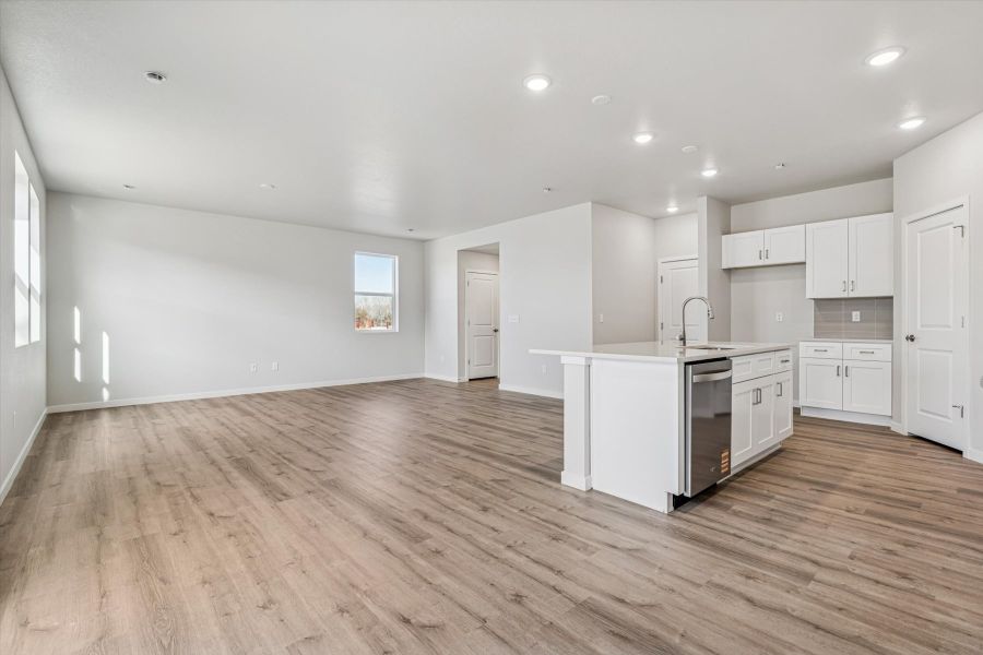 A large kitchen with white cabinets.
