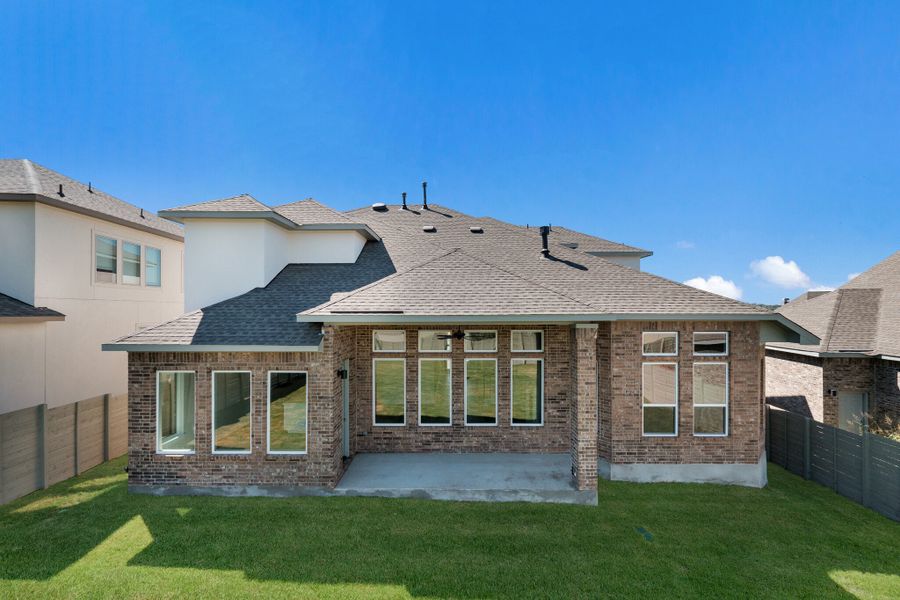 Exterior details and patio area of a home in The Grove at Vintage Oaks, New Braunfels (Image 4).