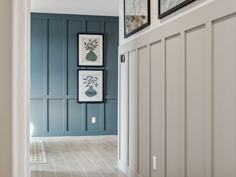 A hallway with white doors.