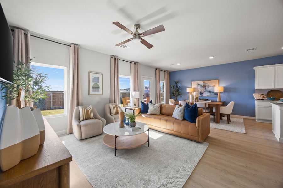 A living room with a large window. A living room with a large window.