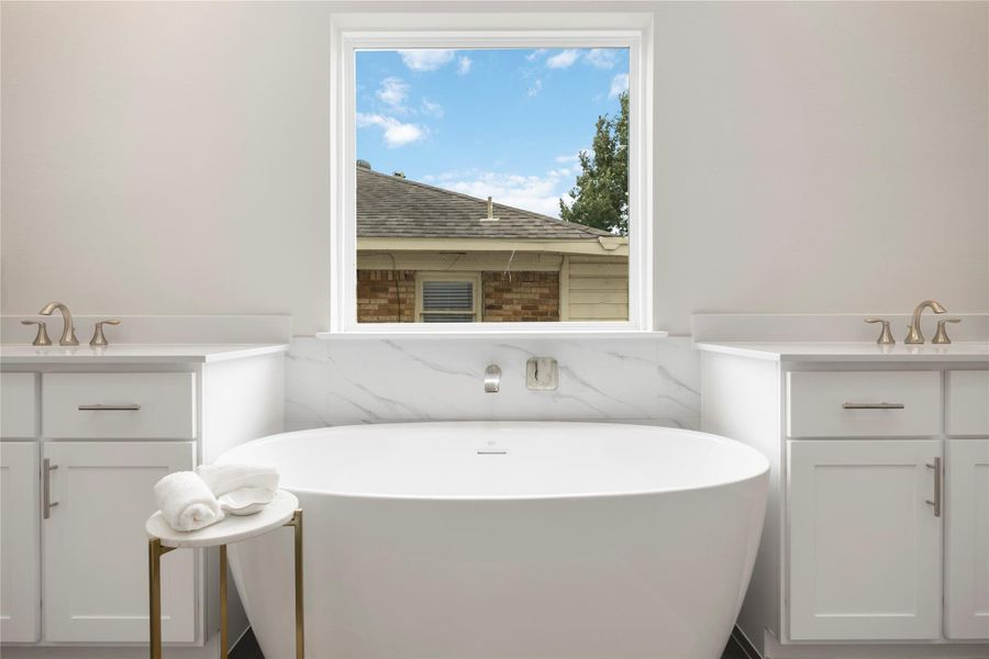 A close-up of the vessel bathtub offers a glimpse into tranquil moments waiting in the privacy of your ensuite retreat.